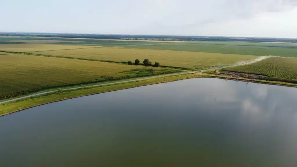 Arkansas fields with large pond