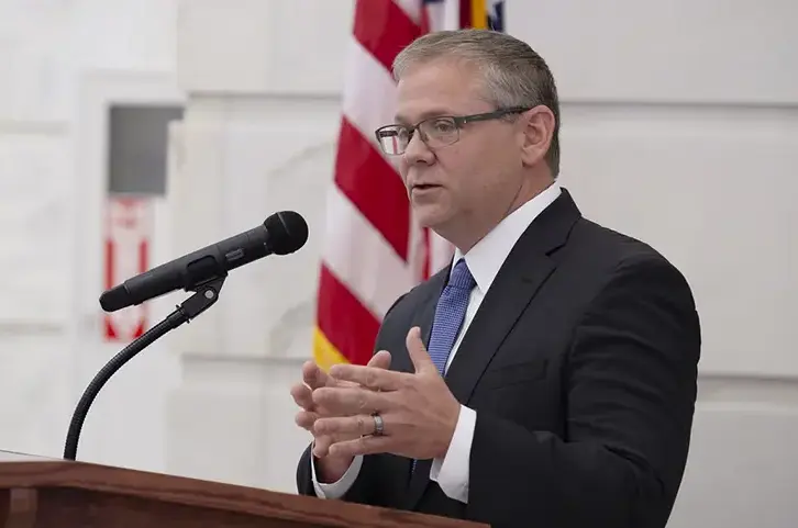 John Thurston speaks at podium