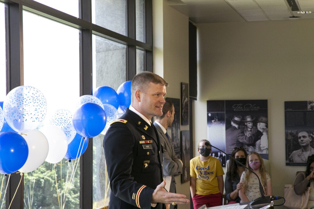 Man in uniform speaking